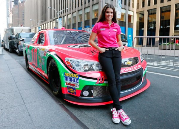 Danica Patrick, driver of the #10 GoDaddy.com Chevrolet unveils the new pink color scheme in support of Breast Cancer Awareness Month at FOX on October 1, 2013 in New York City. Danica Patrick, driver of the #10 GoDaddy.com Chevrolet unveils the new pink color scheme in support of Breast Cancer Awareness Month at FOX on October 1, 2013 in New York City.
