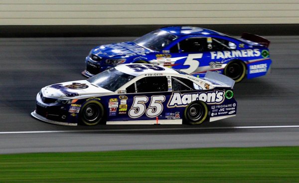 JOLIET, IL - Brian Vickers, #55 , races Kasey Kahne, driver of the #5 Farmers Insurance Chevrolet, during the NASCAR Sprint Cup Series Geico 400 at Chicagoland Speedway on September 15, 2013 in Joliet, Illinois. JOLIET, IL - Brian Vickers, #55 , races Kasey Kahne, driver of the #5 Farmers Insurance Chevrolet, during the NASCAR Sprint Cup Series Geico 400 at Chicagoland Speedway on September 15, 2013 in Joliet, Illinois.