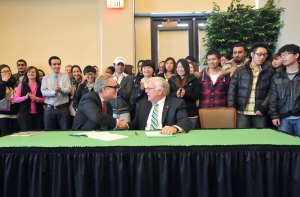Marshall and INTO University Partnerships agreement will bring students from across the world to Huntington
Andrew Colin, left, chairman of INTO University Partnerships, and Marshall President Dr. Stephen J. Kopp shake hands after signing an agreement today.