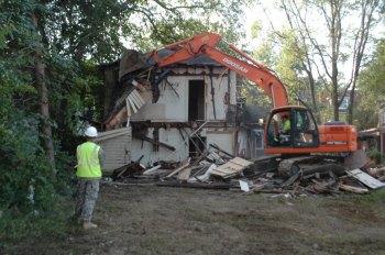Working Together: Houses Keep Coming Down We'll Huff and Puff and Bring Down the Abandoned Houses