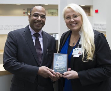 Awadh recognized as January Resident of the Month Hesham Awadh, M.D., (left) is pictured with Eva Patton-Tackett, M.D., internal medicine residency program director at the Marshall University Joan C. Edwards School of Medicine
