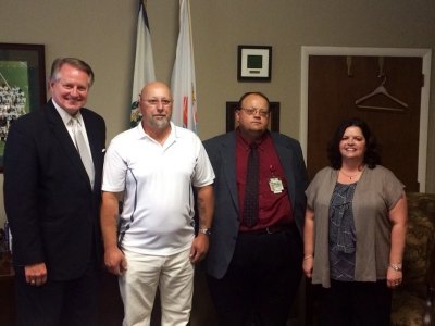 Huntington's New Vision of Labor Management Described to Council Pictured with Howard (second from left) is Mayor Steve Williams, Public Works Director David Hagley and Kim Carr, program coordinator for the Local Technical Assistance Program