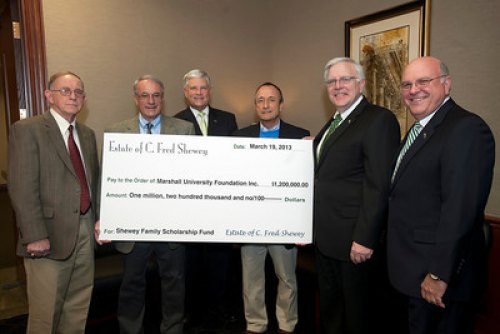 MU Foundation establishes need-based Shewey Family Scholarship Program James D. Thornburg, Bill Shewey, Dr. Ron Area, Bob Shewey, Marshall President Stephen J. Kopp and Gary White pose for a photo around an oversized check for $1.2 million presented to the Marshall Foundation