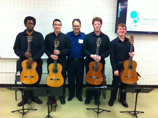 MU guitar ensemble to visit University of Costa Rica Marshall guitar ensemble students Kareem McCullough, Rodrigo Almeida, Jonathan Thorne and Erik Anderson stand with Associate Professor of Music and Brazilian native Dr. Julio Alves (center) before their trip to Costa Rica