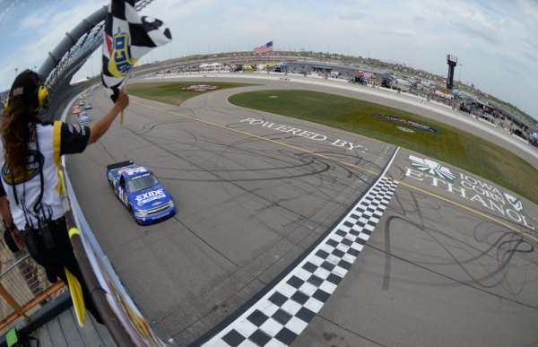 NASCAR: Buescher's late charge nets Iowa truck victory James Buescher, driver of the #31 Motomaster Eliminator Chevrolet, crosses the finish line to win the NASCAR Camping World Truck Series Fan Appreciation 200 presented by New Holland at the Iowa Speedway on September 8, 2013 in Newton, Iowa.