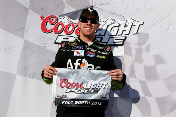 Carl Edwards Parlays Late Draw Into Texas Pole Carl Edwards, driver of the #99 Aflac Ford, poses with the Coors Light Pole Award after qualifying for the pole for the NASCAR Sprint Cup Series AAA Texas 500 at Texas Motor Speedway on November 1, 2013 in Fort Worth, Texas.
